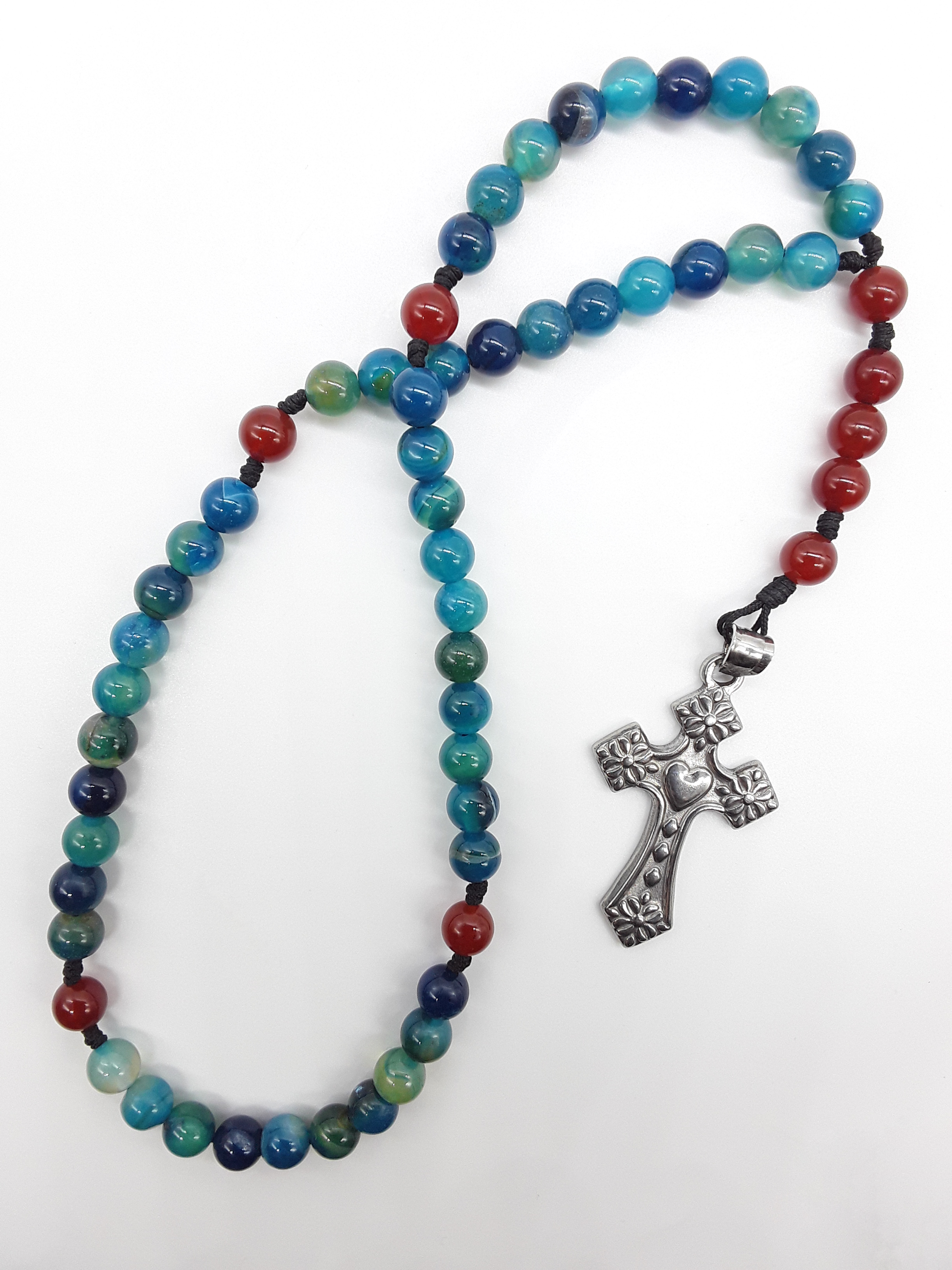 Pocket Catholic rosary with Agate and Carnelian beads and stainless steel heart cross on white background