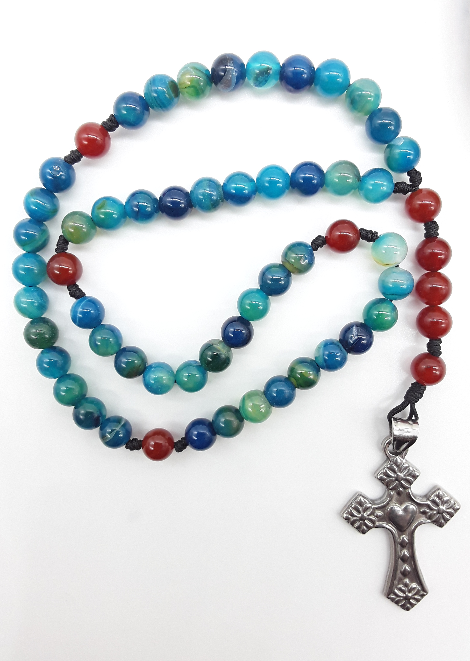 Pocket Catholic rosary with Agate and Carnelian beads and stainless steel heart cross on white background