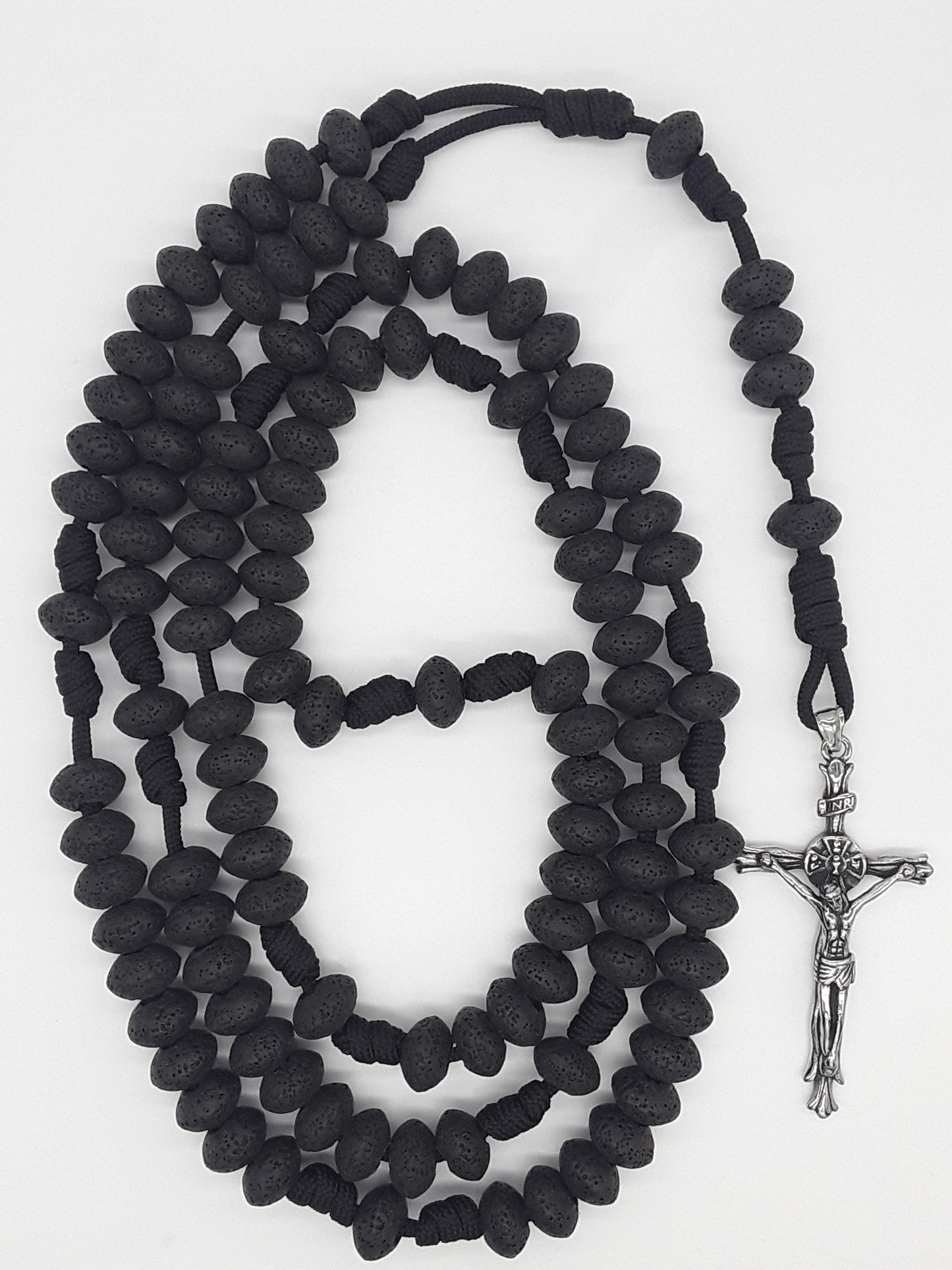 10-Decade Catholic Paracord Rosary with lava stone beads and stainless steel crucifix, handcrafted by Polmadeva for endurance and steady prayer