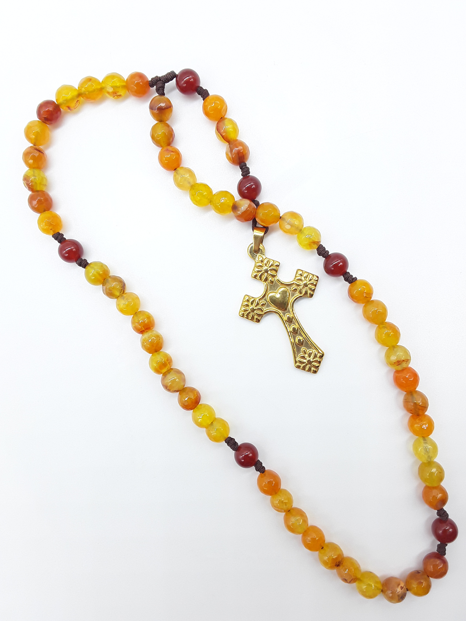 Pocket Catholic Rosary with Agate and Carnelian beads and steel cross, arranged on white background