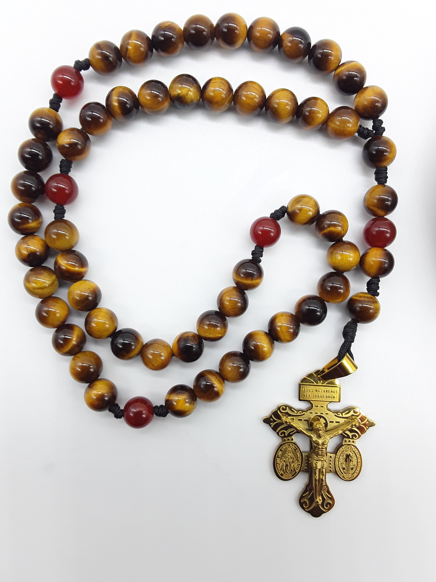 Pocket Catholic Rosary made of Tiger’s Eye and Carnelian beads with steel crucifix, photographed on a white background