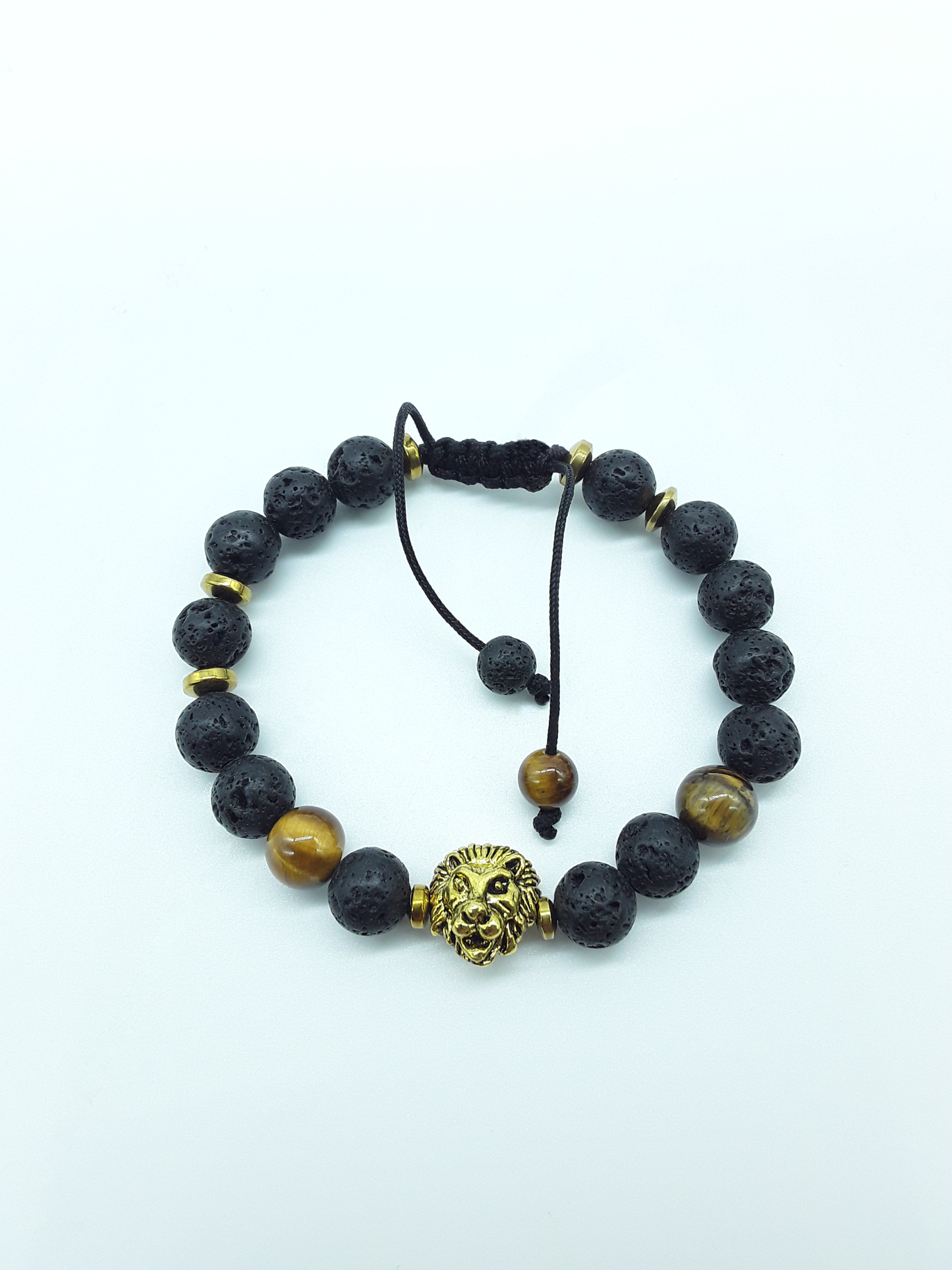 Holdfast bracelet with Lava and Tiger’s Eye plus Hematite beads and gold-toned lion centerpiece on a clean white background