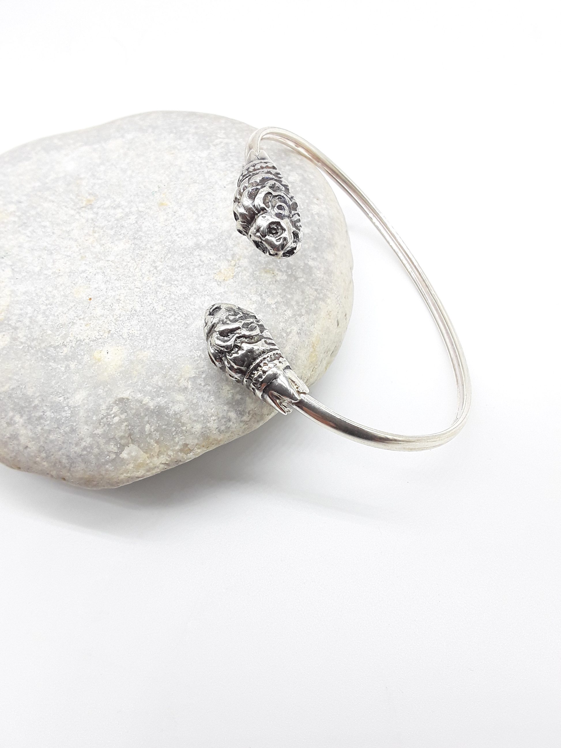 Lion Presence sterling silver cuff bracelet on stone — Polmadeva