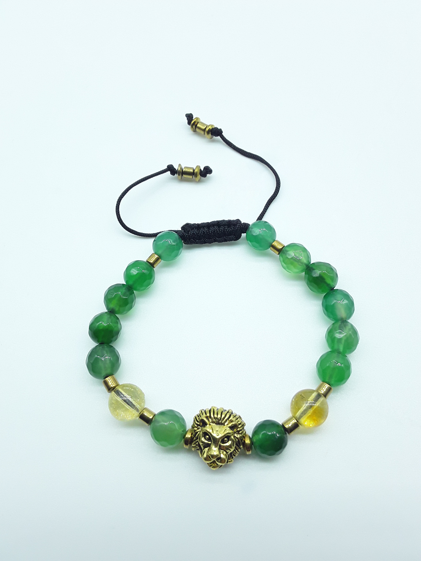 Quiet Ascent Lion Bracelet by Polmadeva with citrine, green agate and hematite beads on a white background