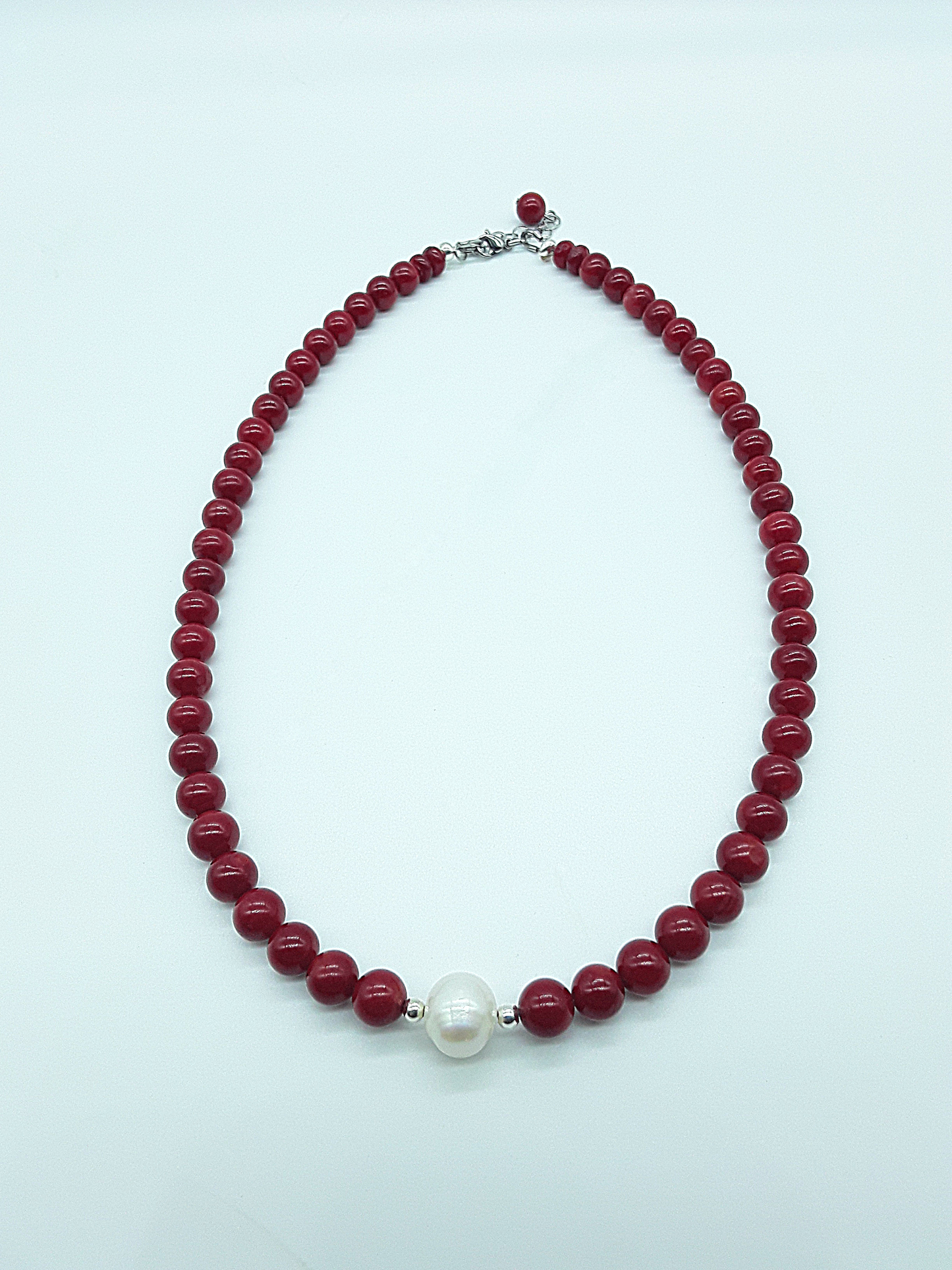 Rise with Fire Necklace crafted with red coral beads and a central pearl, symbolizing courage, vitality, and inner fire, Polmadeva Courage Rising collection