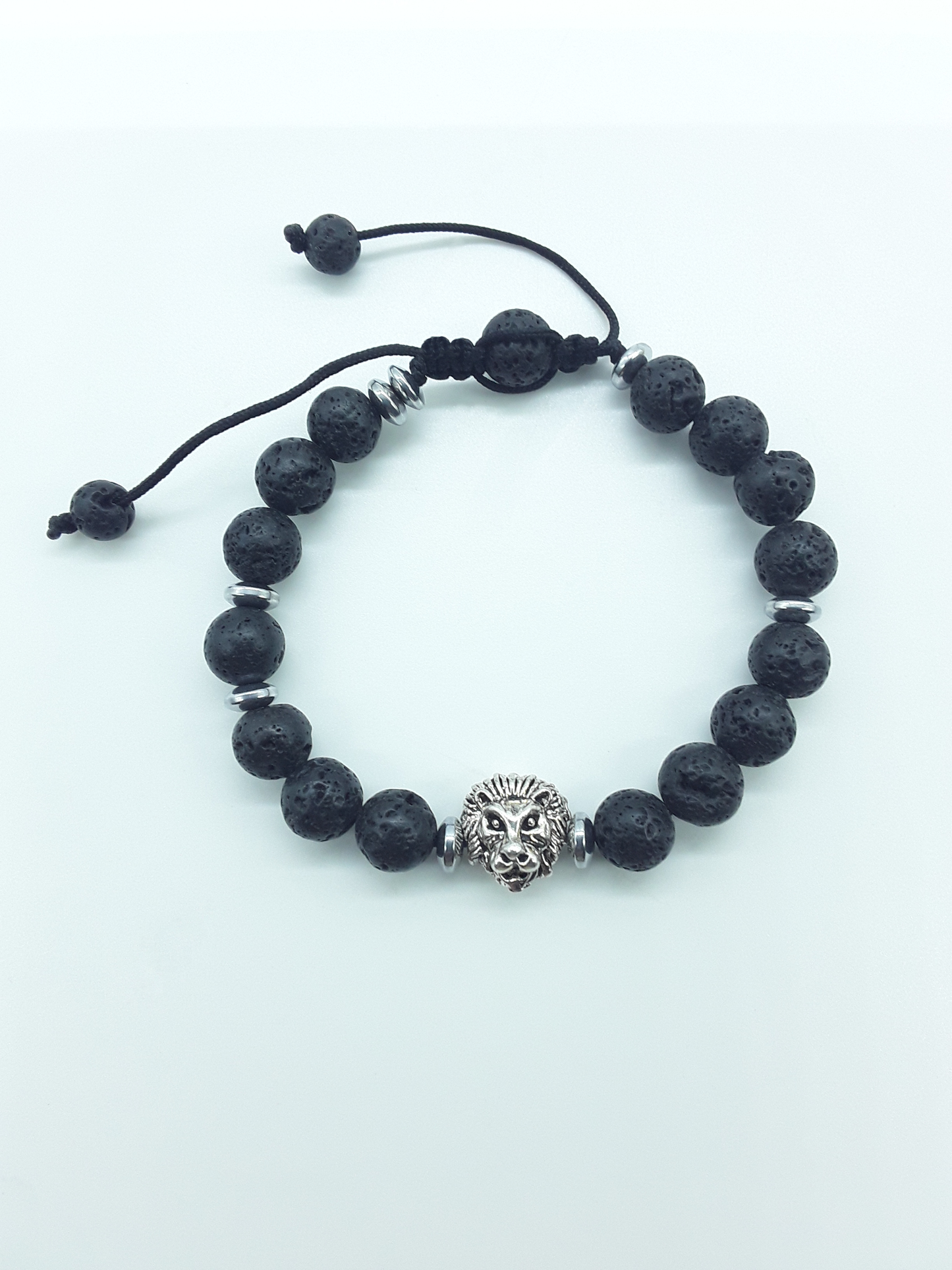 Lava stone lion bracelet with 8mm natural beads and hematite details on a white background