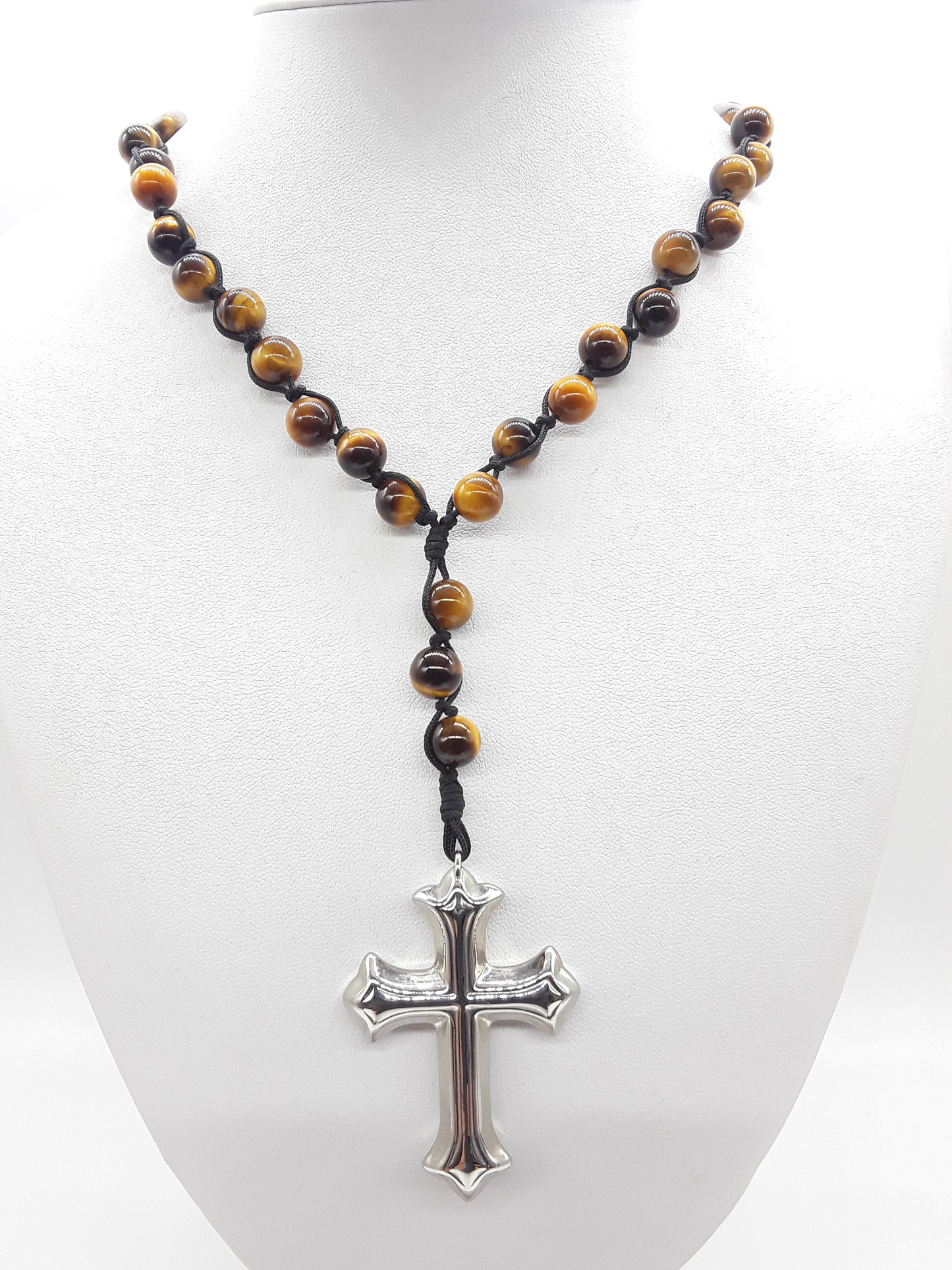 Steady Flame — Tiger’s Eye Catholic Rosary (10 Decade) by Polmadeva worn as necklace on white display bust with stainless steel cross.