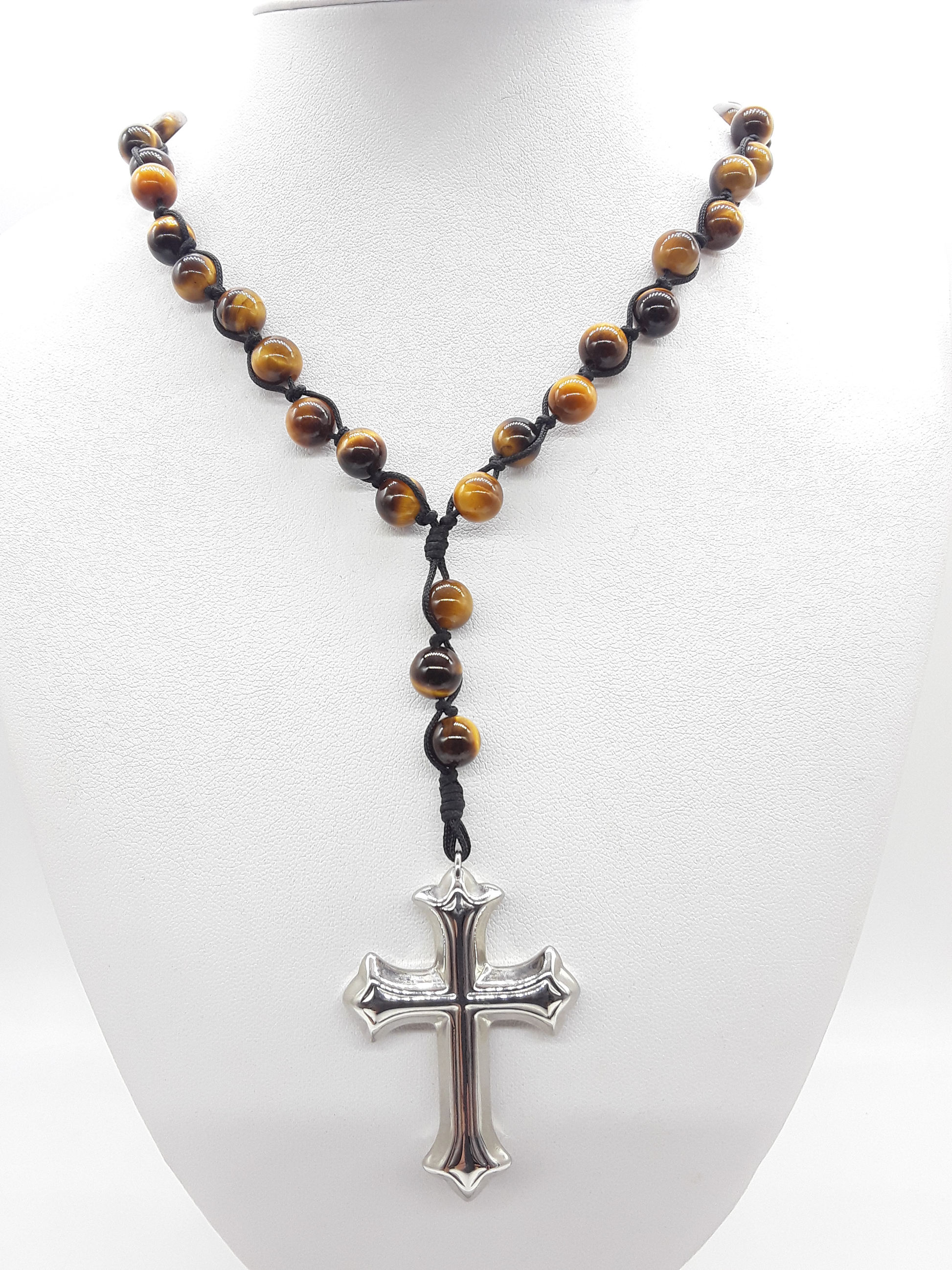 Steady Flame — Tiger’s Eye Catholic Rosary (10 Decade) by Polmadeva worn as necklace on white display bust with stainless steel cross.