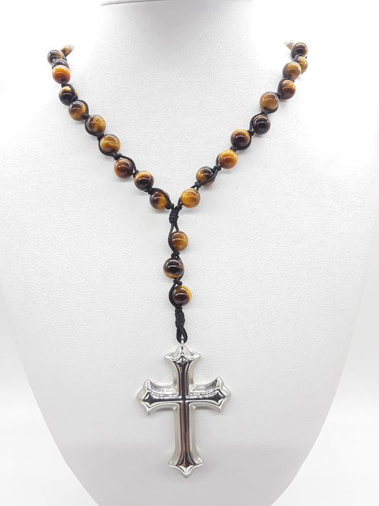 Steady Flame — Tiger’s Eye Catholic Rosary (10 Decade) by Polmadeva worn as necklace on white display bust with stainless steel cross.
