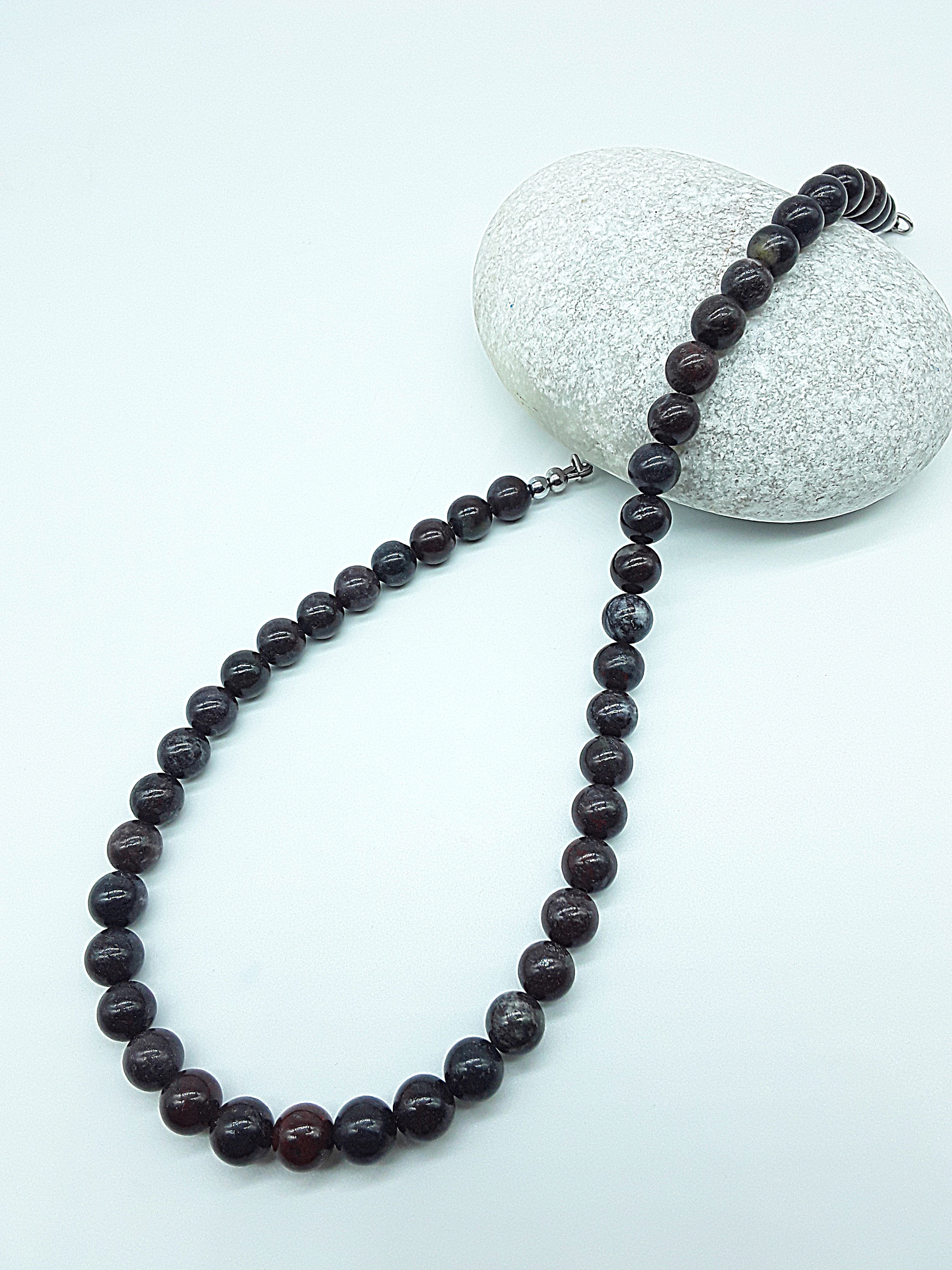 Stone of Resolve Necklace featuring bloodstone beads styled on stone, Polmadeva Quiet Power collection