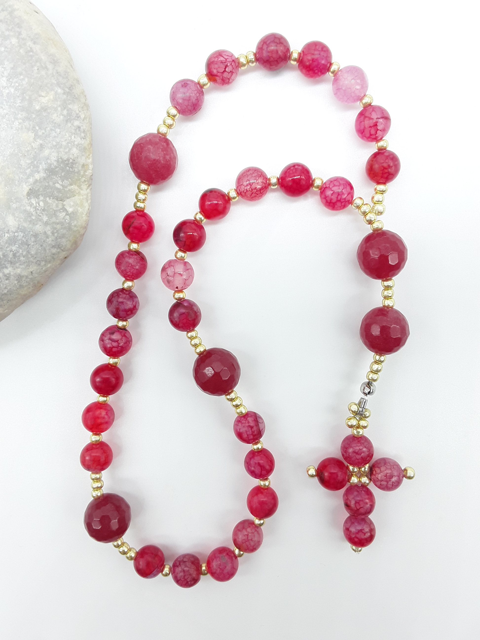 The Burning Hymn Anglican Prayer Beads by Polmadeva beside natural stone, featuring Dragon Vein beads, Agate, and Miyuki details