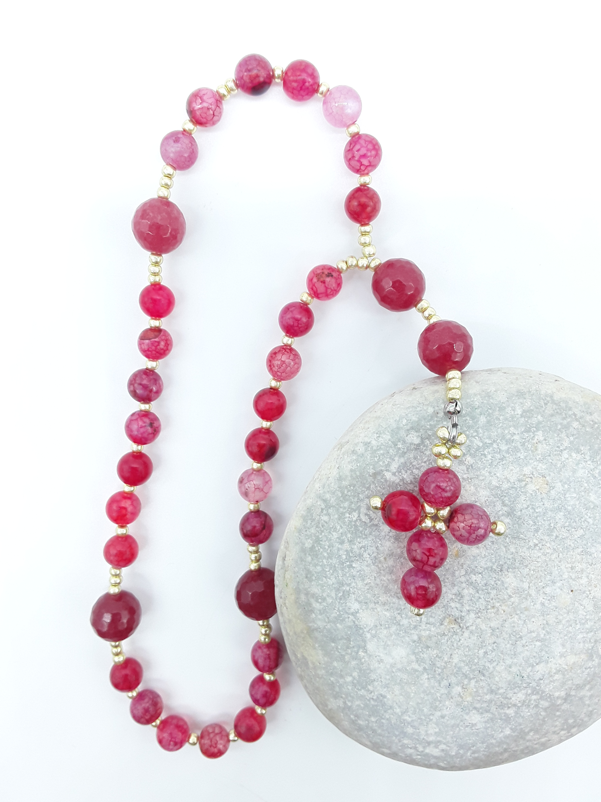 The Burning Hymn Anglican Prayer Beads by Polmadeva placed on stone, crafted with Dragon Vein beads, Agate stones, and Miyuki spacers