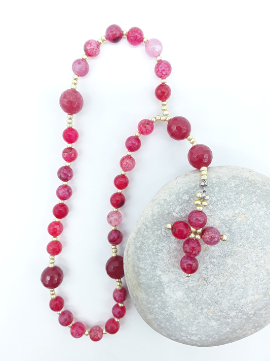 The Burning Hymn Anglican Prayer Beads by Polmadeva placed on stone, crafted with Dragon Vein beads, Agate stones, and Miyuki spacers