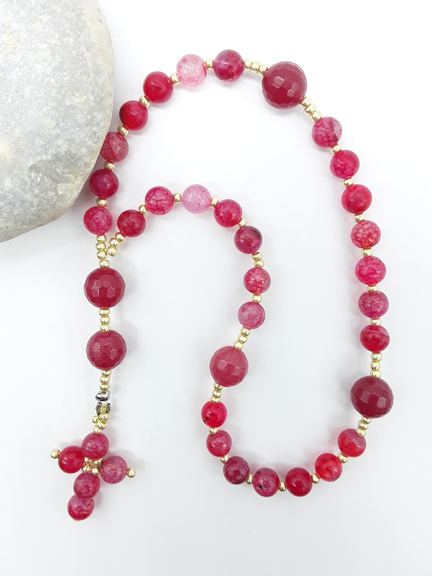 The Burning Hymn Anglican Prayer Beads by Polmadeva beside natural stone, featuring Dragon Vein beads, Agate, and Miyuki details