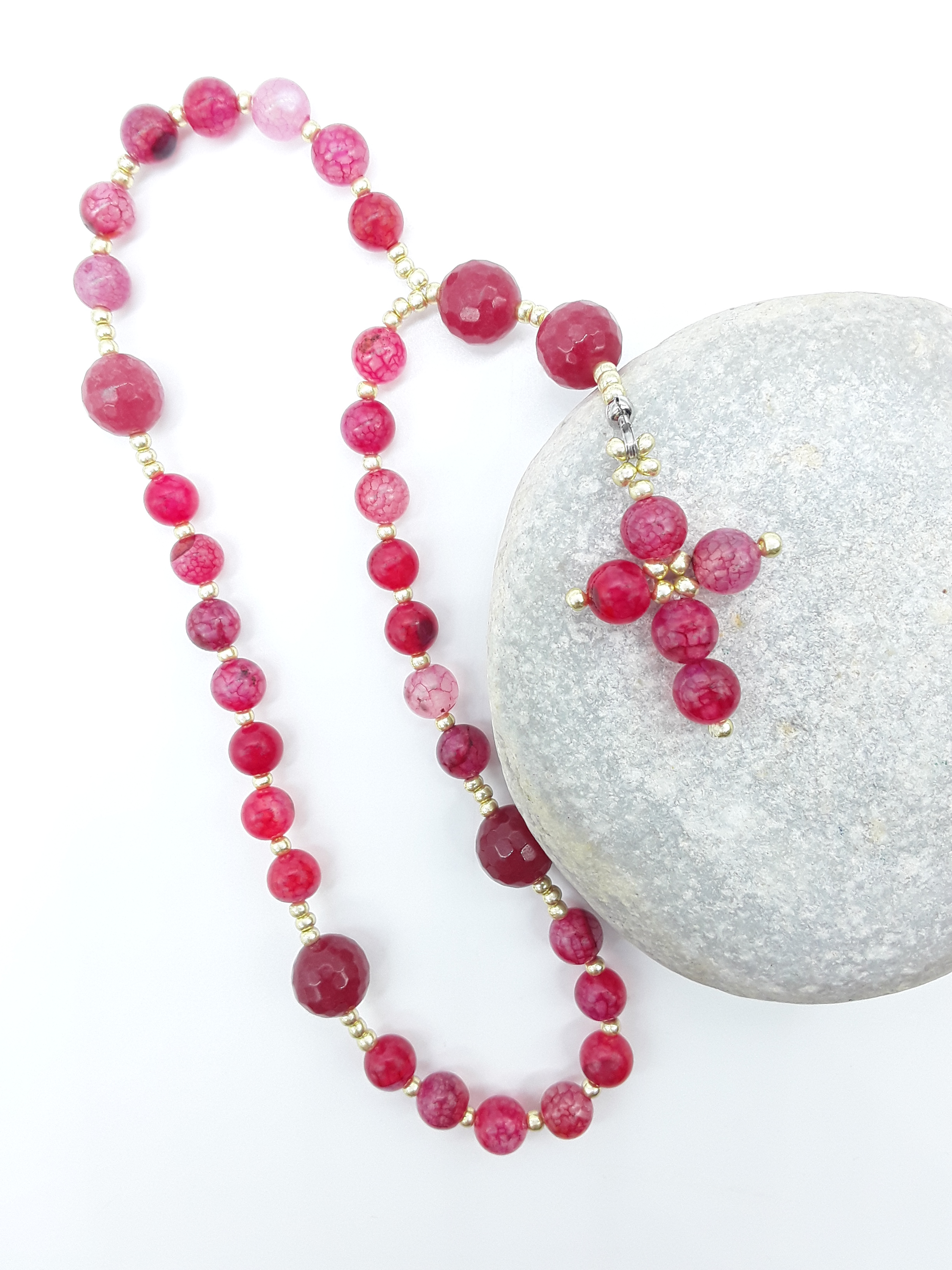 The Burning Hymn Anglican Prayer Beads by Polmadeva placed on stone, crafted with Dragon Vein beads, Agate stones, and Miyuki spacers