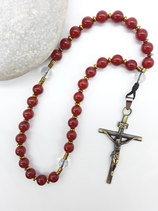 Carnelian Orthodox Rosary with crystal and hematite accents displayed beside natural stone, Polmadeva