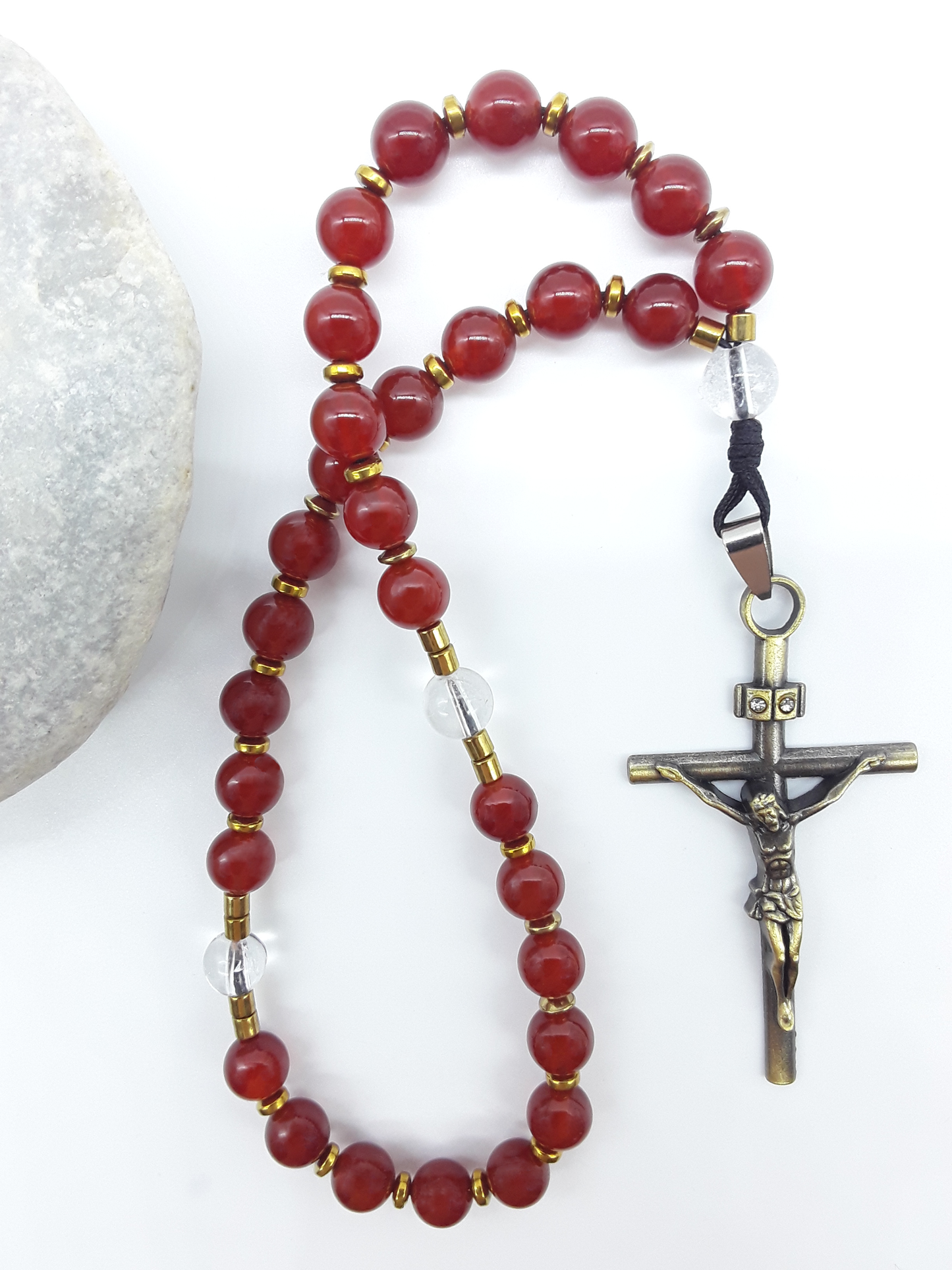 Carnelian Orthodox Rosary with crystal and hematite accents displayed beside natural stone, Polmadeva