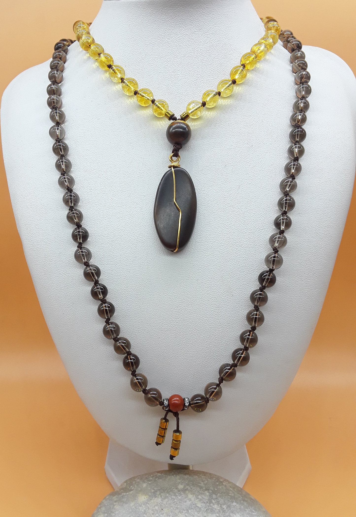 Citrine and Smoky Quartz Mala Beads with Agate pendant displayed on white mannequin, Polmadeva