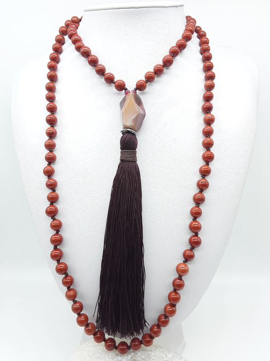 Full Red Jasper Mala Beads with Agate guru bead and dark tassel displayed on white background, Polmadeva
