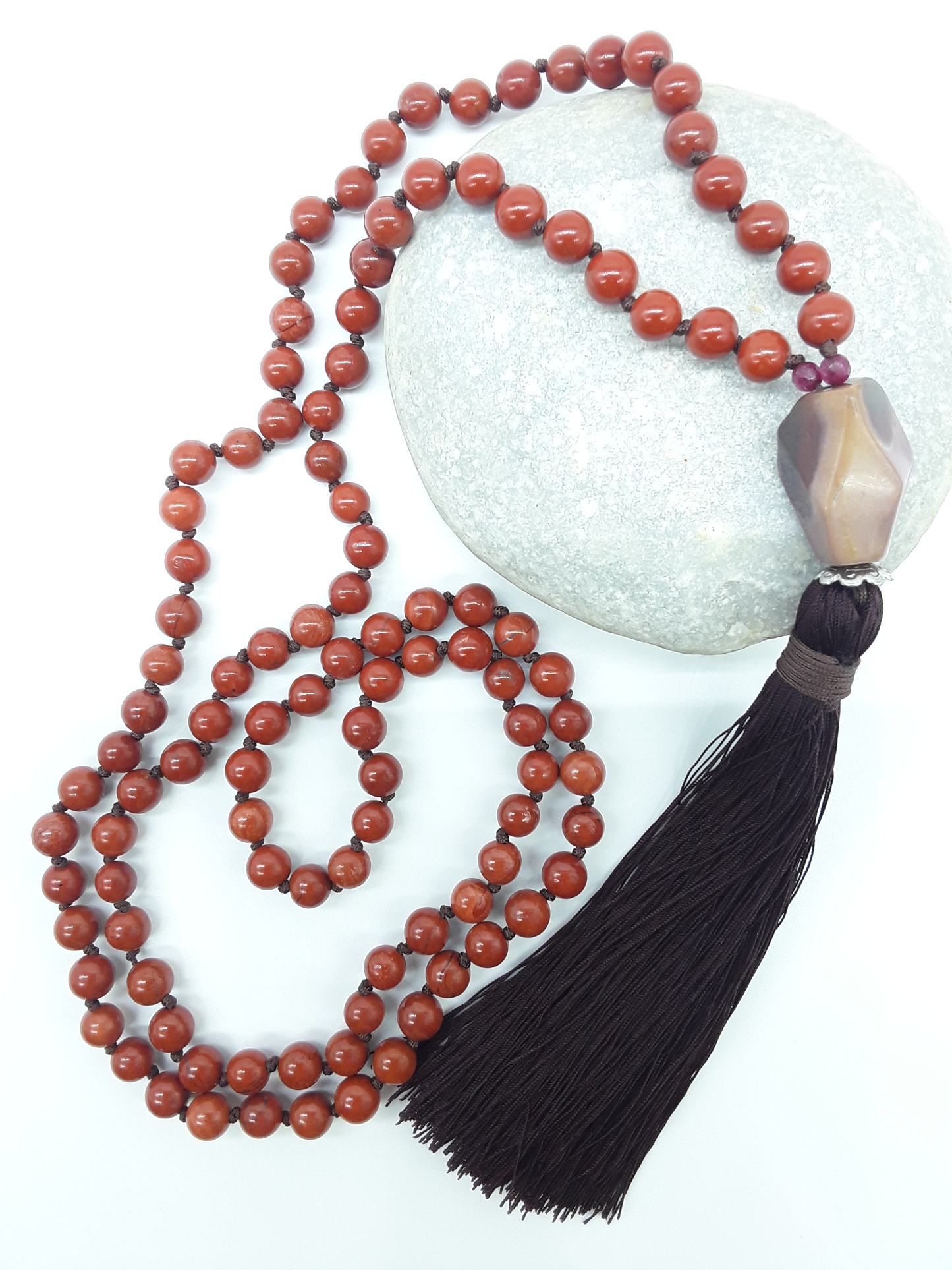 Close view of Red Jasper Mala Beads with Agate guru bead and dark tassel, Polmadeva
