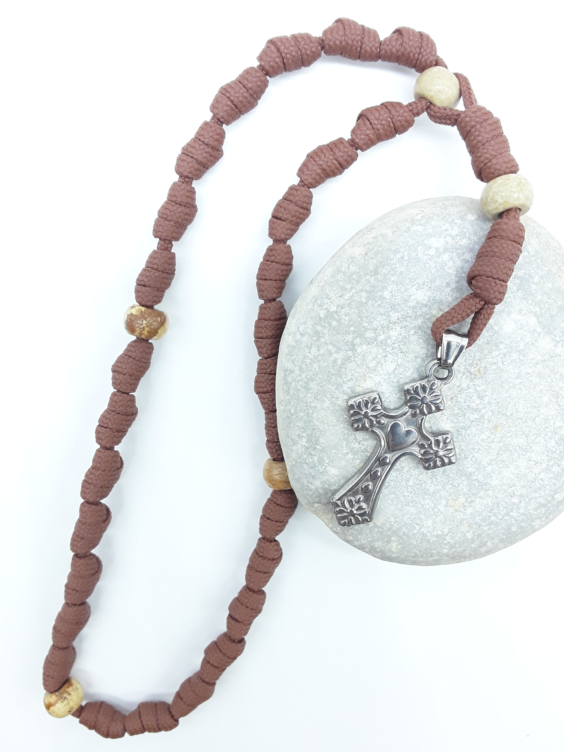 Knotted Anglican Rosary with Jasper elements and floral stainless steel cross arranged on white stone, Polmadeva
