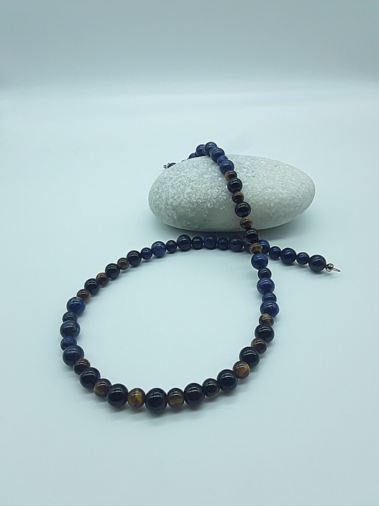 Polmadeva Inner Sight Necklace with lapis lazuli, tiger’s eye and black onyx beads styled on stone, Soul Vision collection