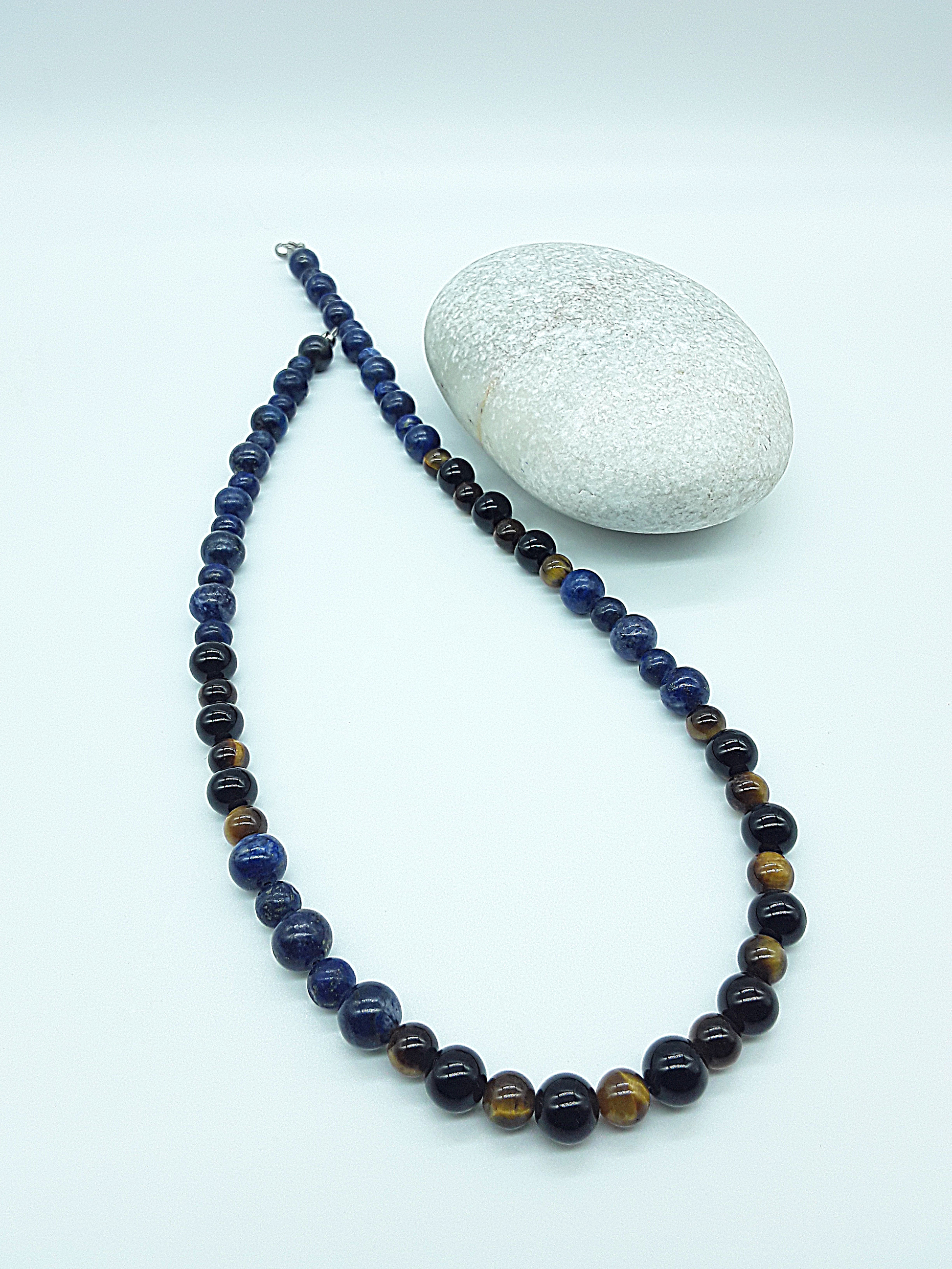 Polmadeva Inner Sight Necklace with lapis lazuli, tiger’s eye and black onyx beads arranged diagonally beside natural stone, Soul Vision collection