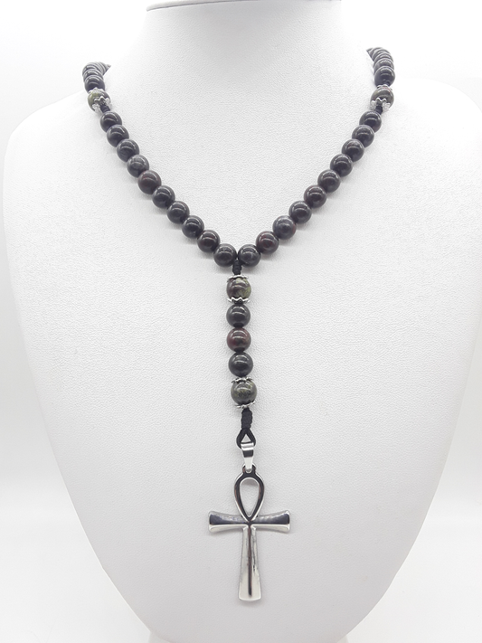 Catholic rosary made of bloodstone beads with stainless steel Ankh cross displayed on mannequin bust