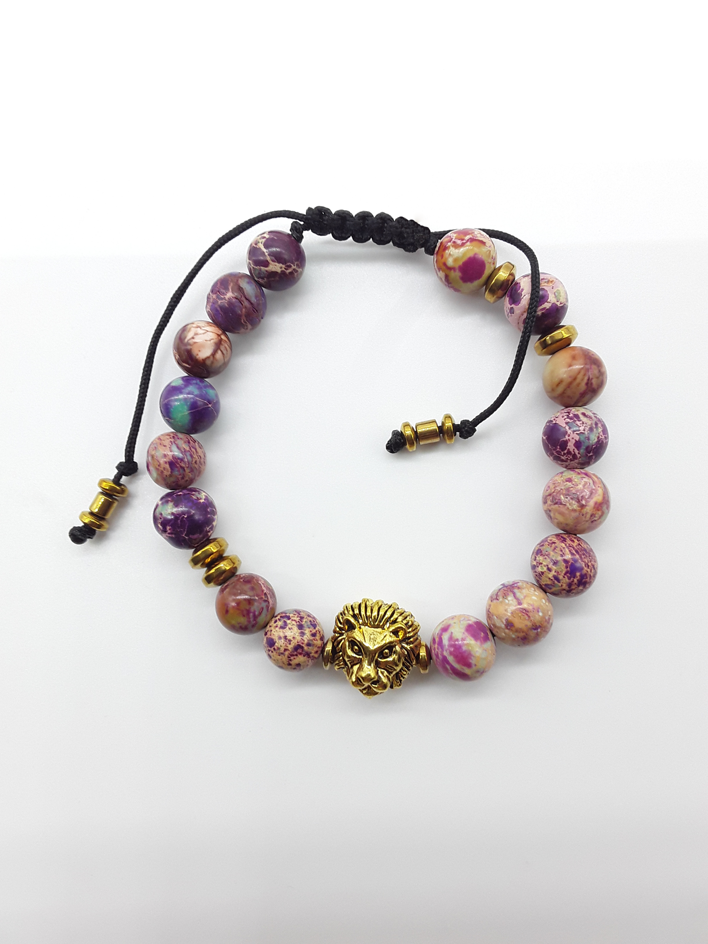 Imperial jasper beaded lion bracelet with hematite accents on a white background