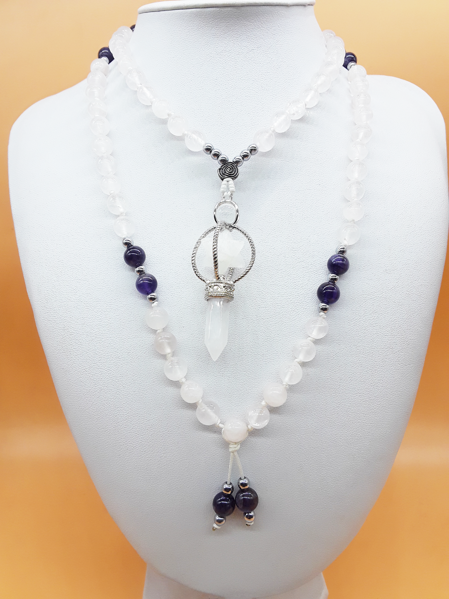 Quartz and Amethyst Mala Beads with Natural Quartz Crystal pendant displayed on white mannequin, Polmadeva