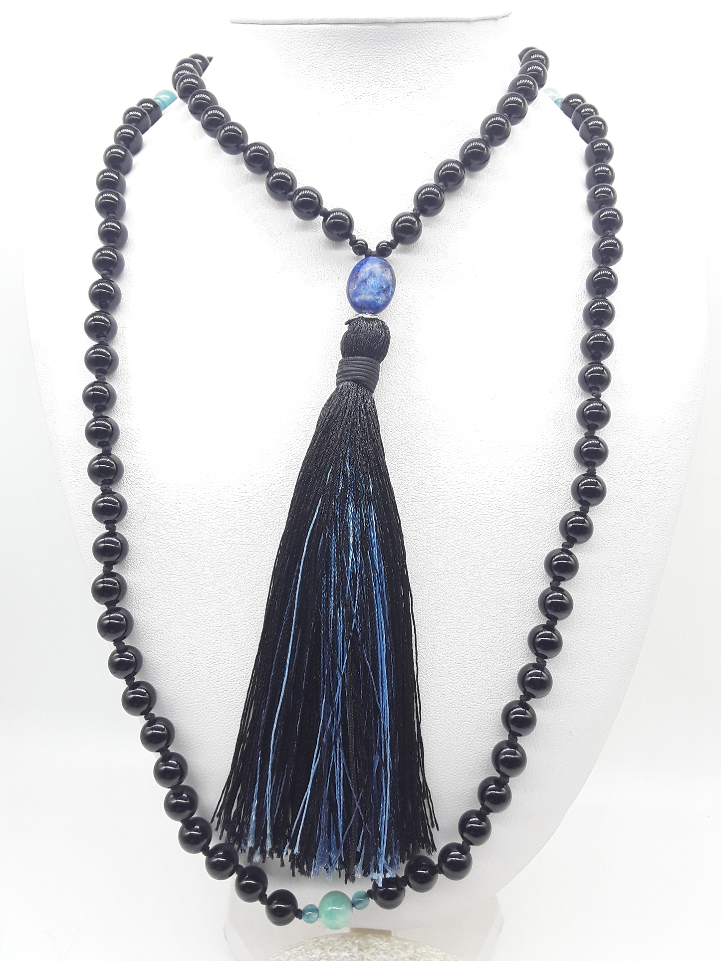Full Black Onyx Mala Beads with Lapis Lazuli, Agate accents and tassel displayed on white background, Polmadeva