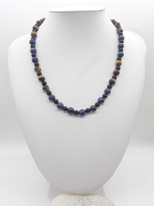 Polmadeva Quiet Sentinel Necklace with lapis lazuli, tiger’s eye and black onyx beads displayed on bust, Guardian Spirit collection