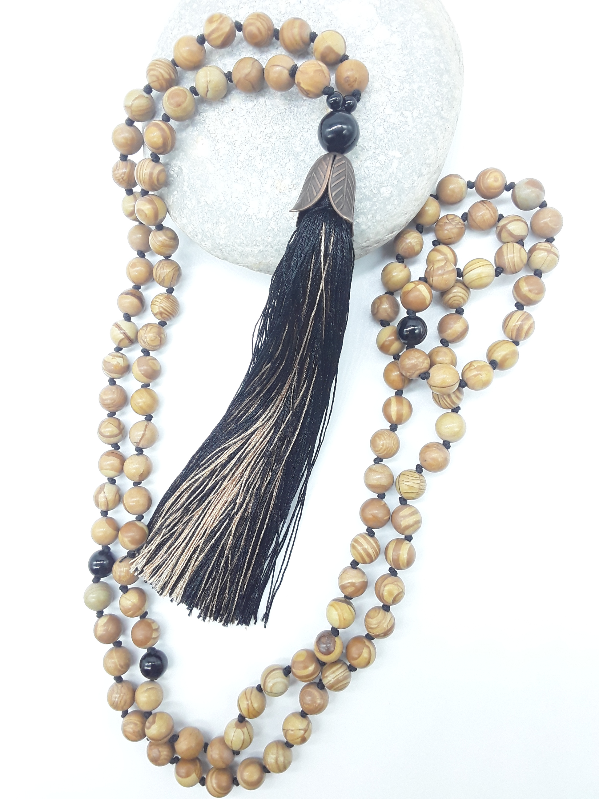 Close view of Tigerskin Jasper Mala Beads with Black Onyx elements and tassel, Polmadeva