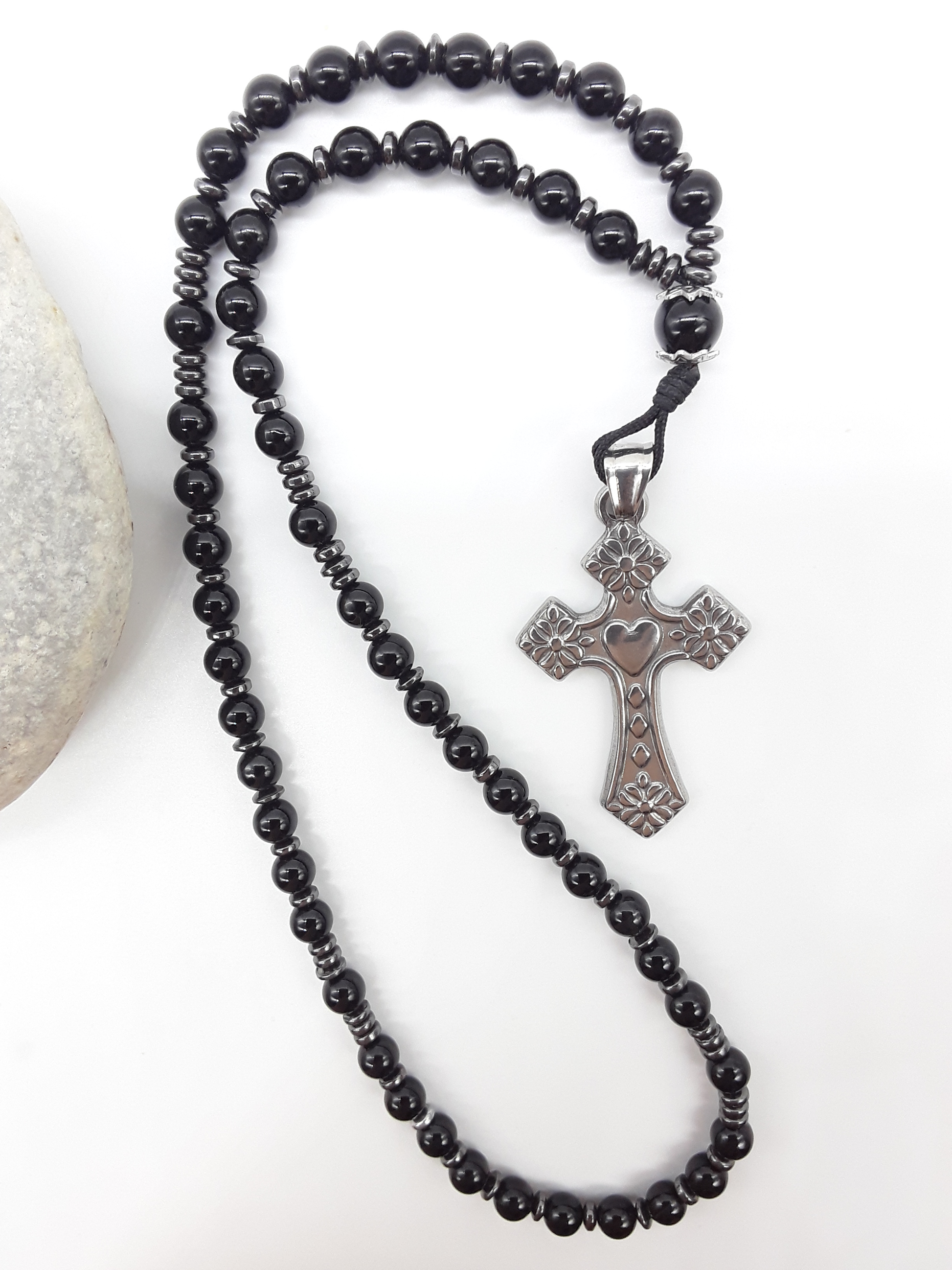 Black Onyx and Hematite Orthodox Rosary with stainless steel cross beside natural stone surface by Polmadeva.