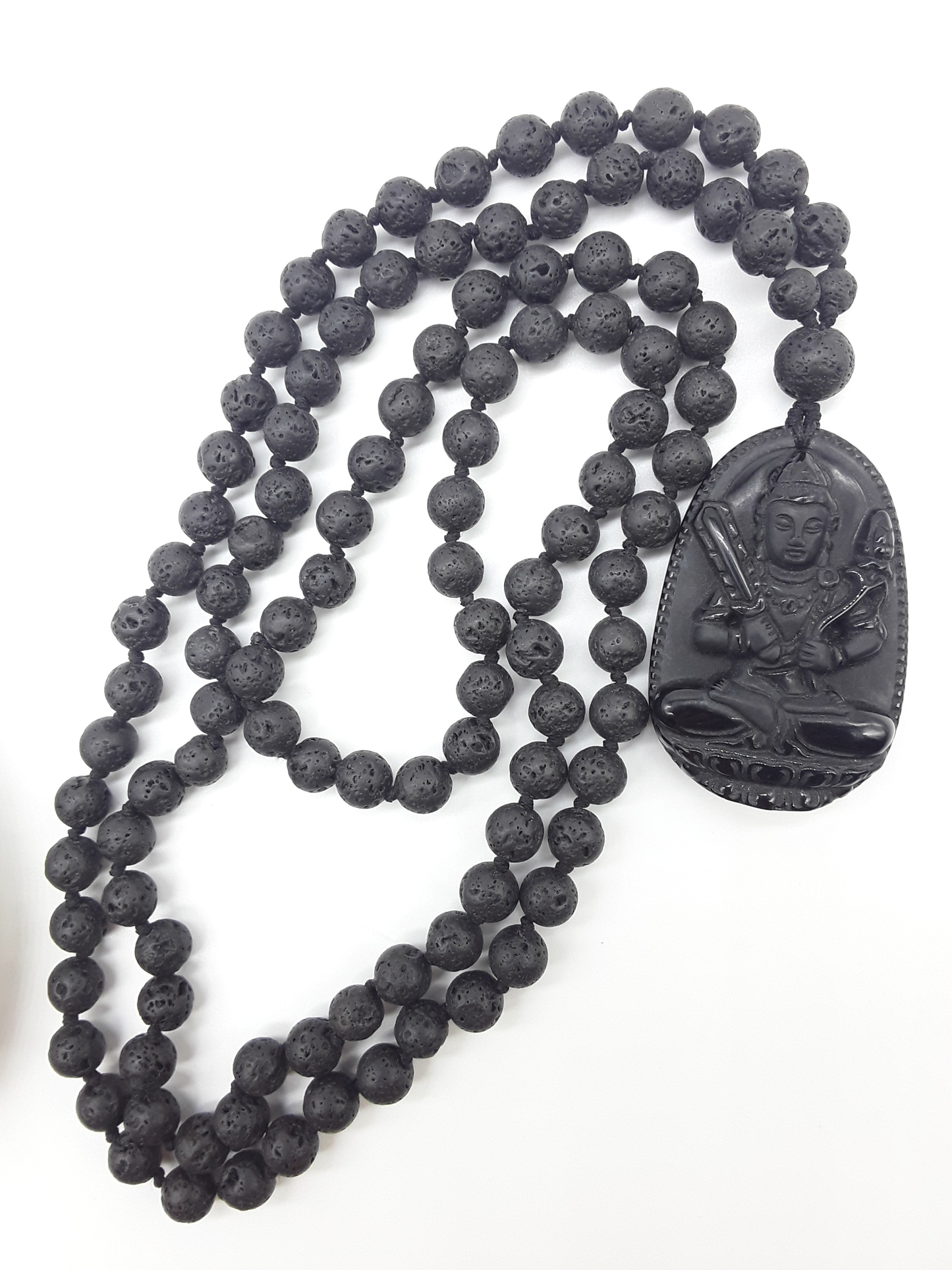 Lava Stone Mala Beads with carved Obsidian pendant displayed on white background, Polmadeva