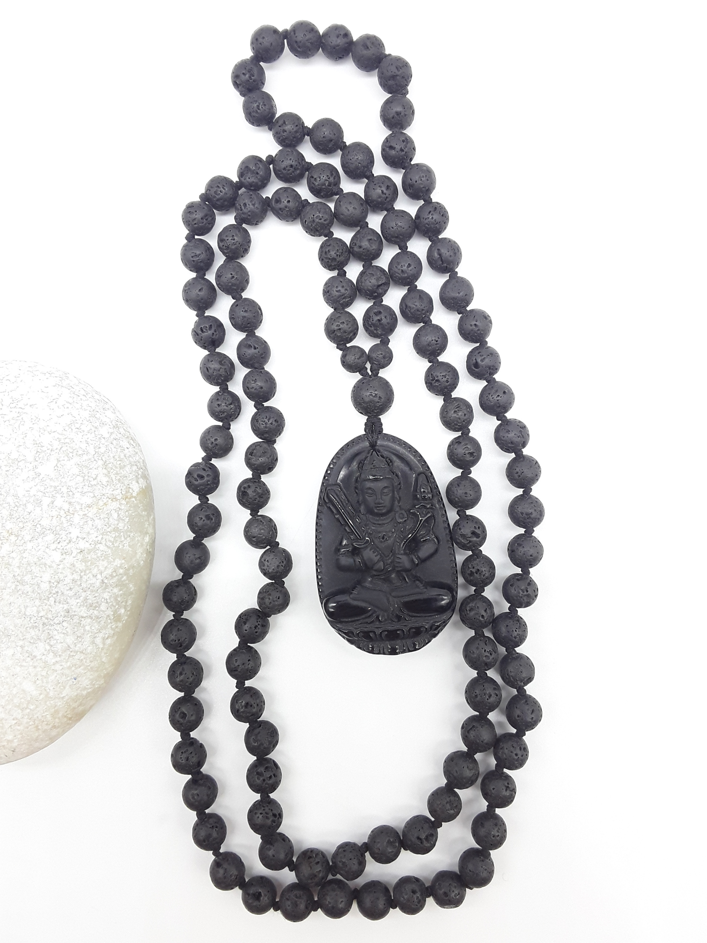 Lava Stone Mala Beads with carved Obsidian pendant displayed on white background, Polmadeva