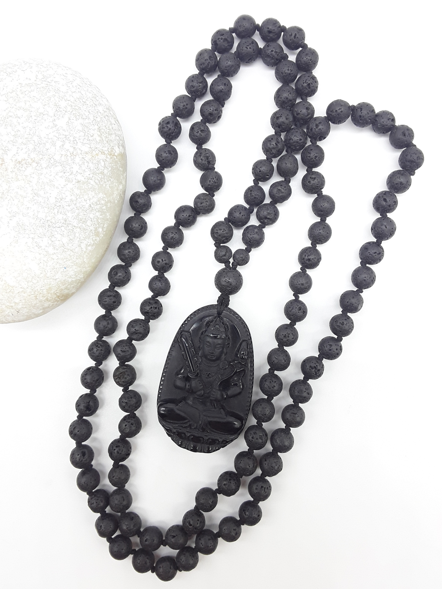Lava Stone Mala Beads with carved Obsidian pendant displayed on white background, Polmadeva