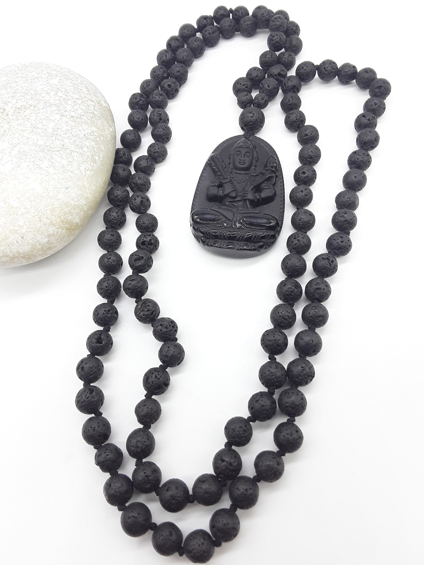 Lava Stone Mala Beads with carved Obsidian pendant displayed on white background, Polmadeva