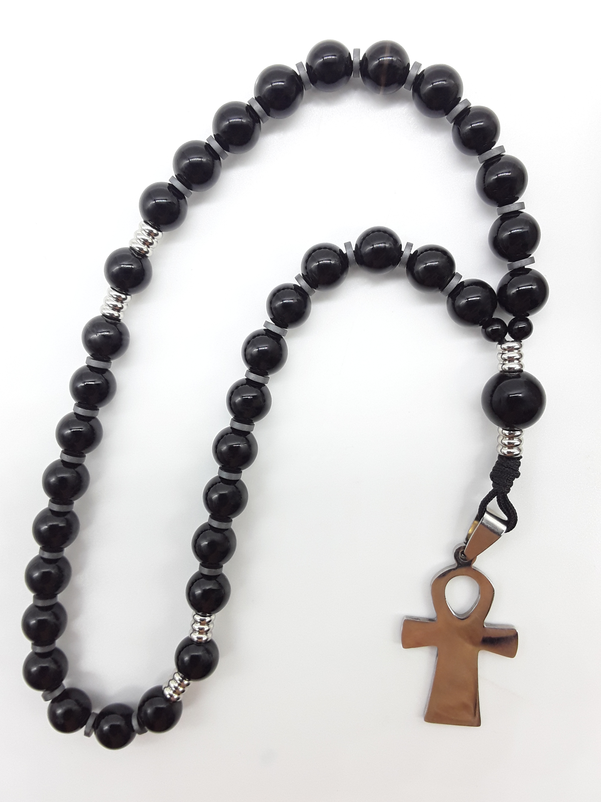 The Steady Presence — Black Onyx Orthodox Rosary by Polmadeva, handcrafted with black onyx beads, hematite spacers, and stainless steel cross, photographed on a clean white background.
