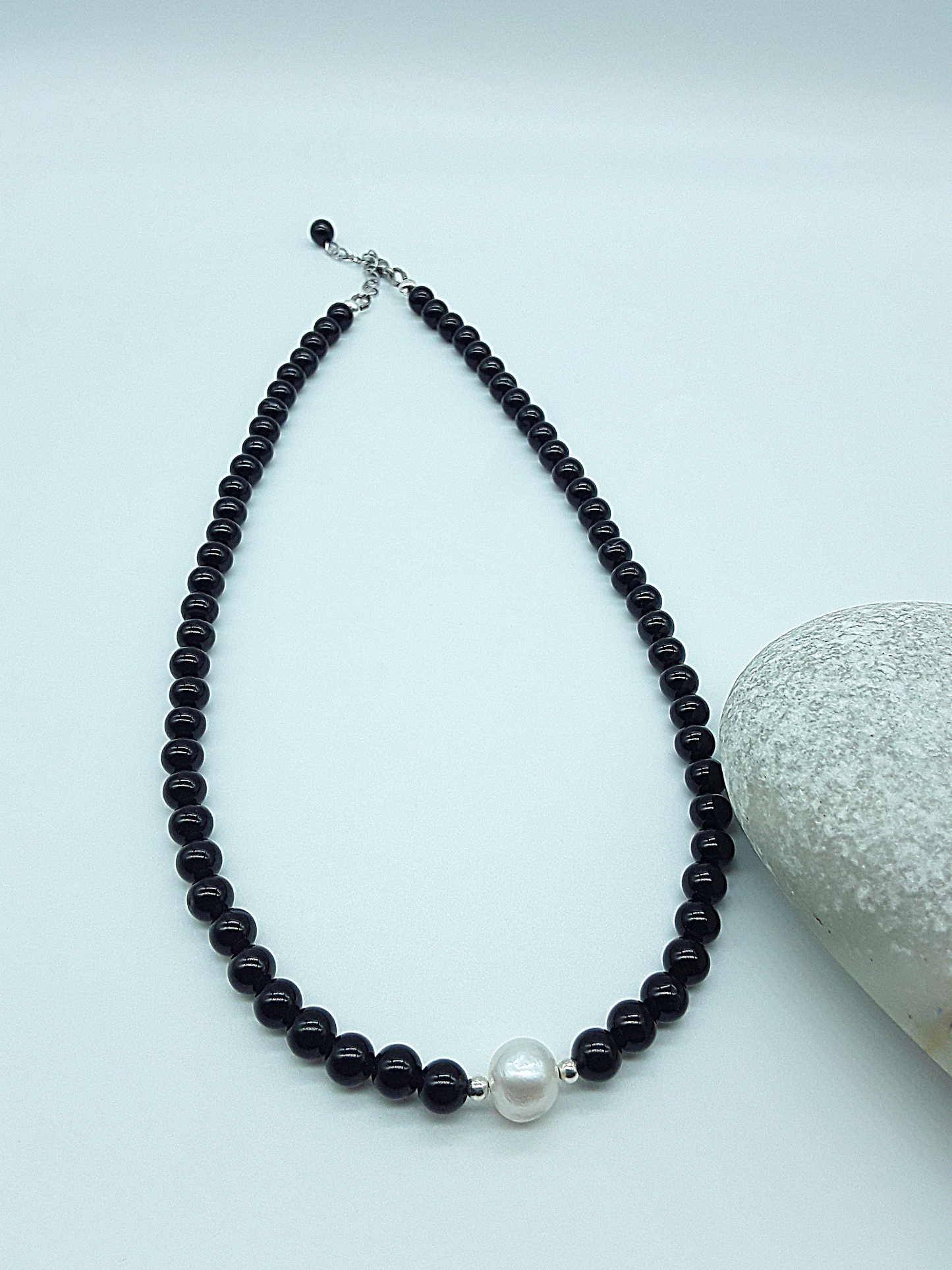 Still Core Necklace by Polmadeva with black onyx beads and single pearl shown in full length with natural stone detail, Sacred Balance collection