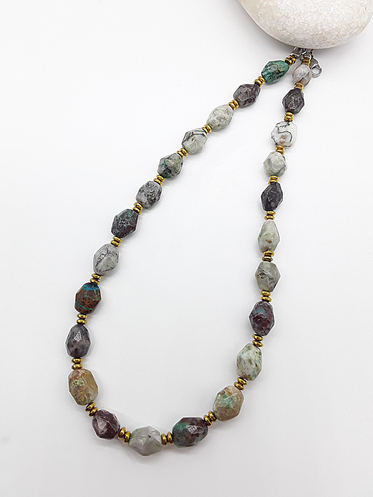 Necklace with multicolored beads on a white background