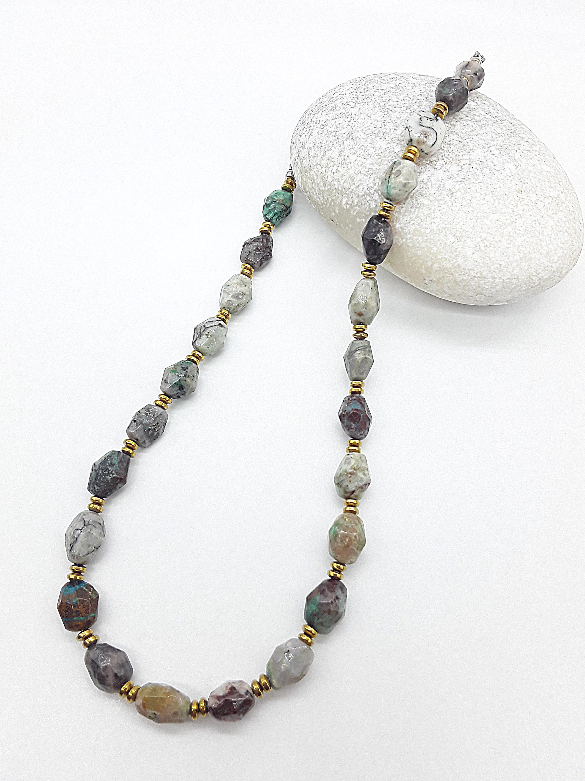 Necklace with natural stone beads on a white background