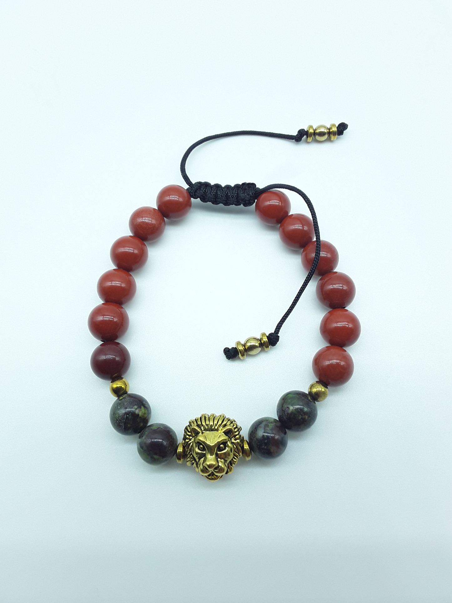 Lion bracelet with red jasper and dragon blood stones on a clean white background