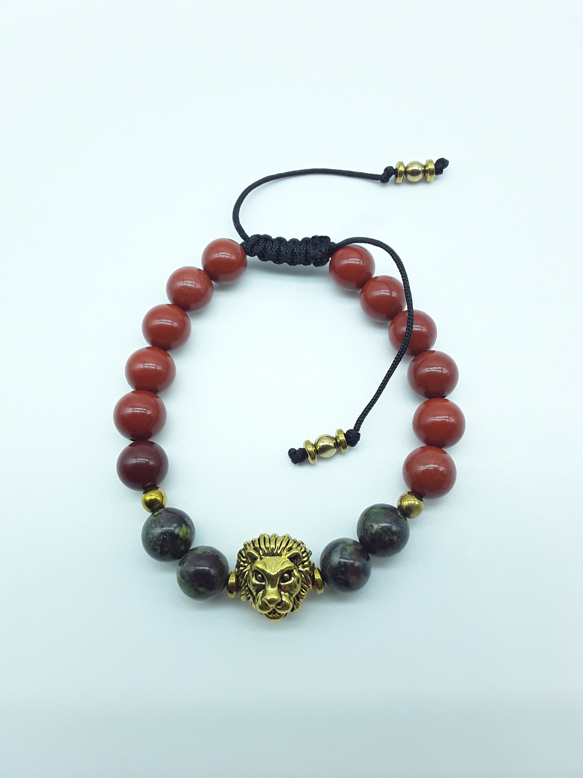 Lion bracelet with red jasper and dragon blood stones on a clean white background